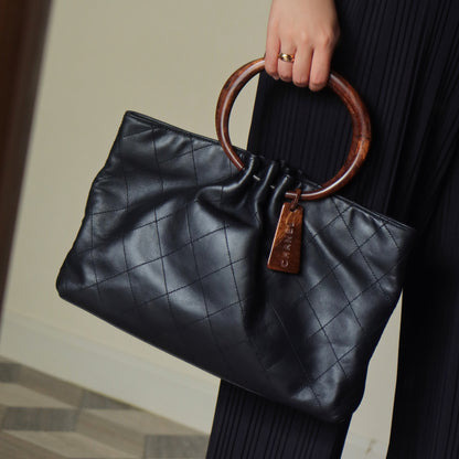 Chanel Vintage Black Lambskin Stitched Wood Resin Top Handle Weekend Bag