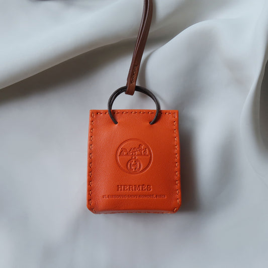 Products Hermes Feu Milo Gold Swift Mini Shopping Bag Charm 1