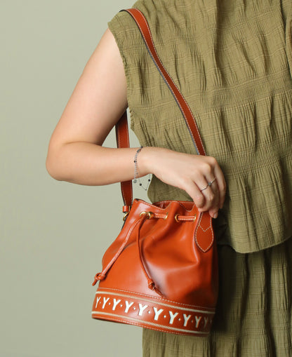 YSL Vintage Terracotta Brown Leather Bucket Shoulder Bag with YSL logo charm