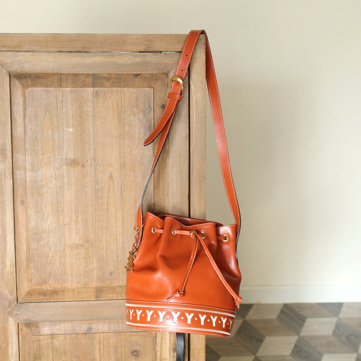 YSL Vintage Terracotta Brown Leather Bucket Shoulder Bag with YSL logo charm