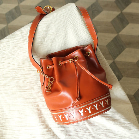 YSL Vintage Terracotta Brown Leather Bucket Shoulder Bag with YSL logo charm