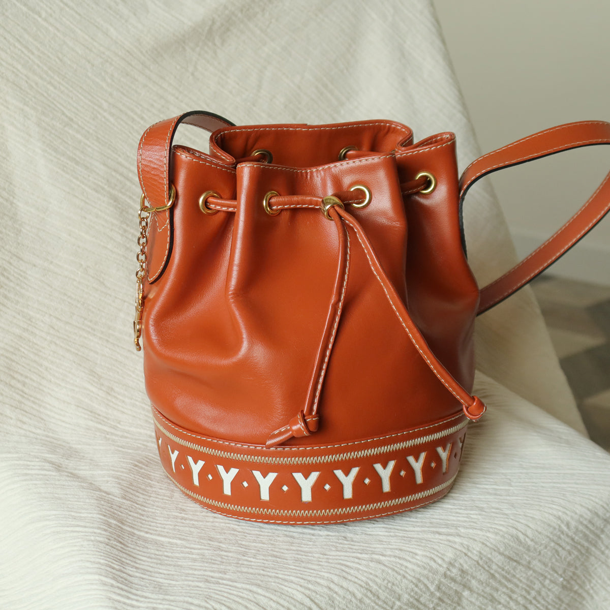 YSL Vintage Terracotta Brown Leather Bucket Shoulder Bag with YSL logo charm