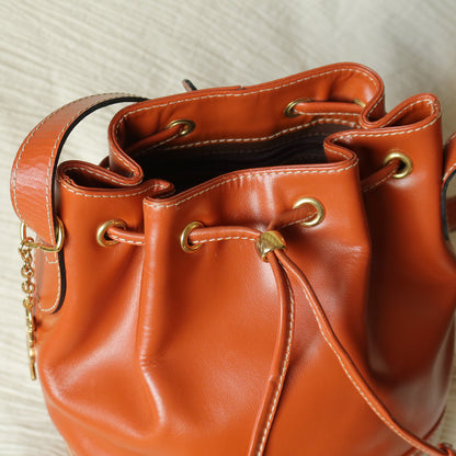 YSL Vintage Terracotta Brown Leather Bucket Shoulder Bag with YSL logo charm