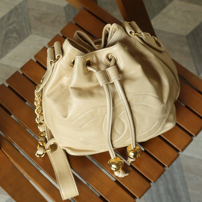 Chanel Vintage Beige Lambskin Coco mark Gold Ball Charm Crossbody Bucket Bag