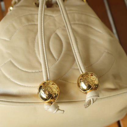 Chanel Vintage Beige Lambskin Coco mark Gold Ball Charm Crossbody Bucket Bag